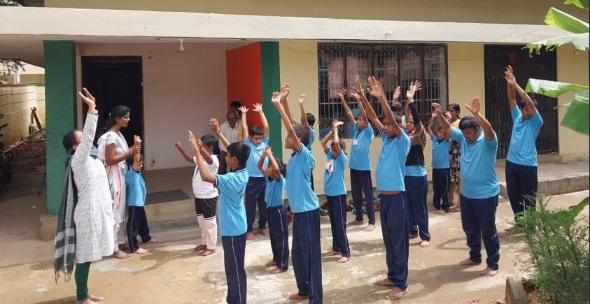 Children learning yoga